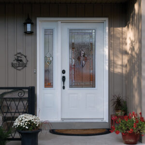 White front door with decorative window and sidelite on the left